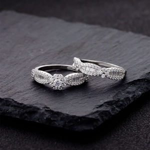Sparkling snowflake sterling silver ring set with micro-pave stones on slate background