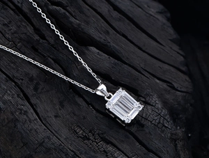 Macro shot of S925 silver necklace with rectangular emerald-cut cubic zirconia pendant
