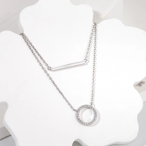 Silver double layer necklace featuring a polished bar and a pavé zircon circle pendant