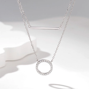 Double layer silver necklace featuring a polished bar and sparkling zircon circle pendant
