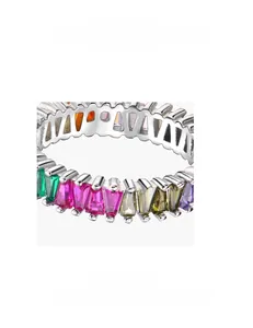 Macro detail of microscopic micro-pave setting on 925 silver triangle colored diamond ring