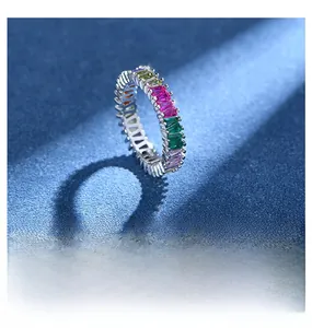 Macro shot of 925 silver eternity ring with colorful rectangle-cut crystal gems