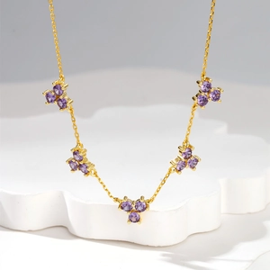 Elegant 18k gold plated necklace with five clusters of round purple crystals on a fine chain