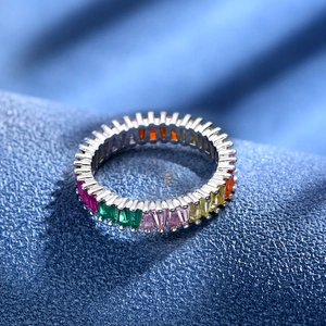 Macro shot of 925 silver eternity ring with colorful rectangular-cut rainbow gemstones