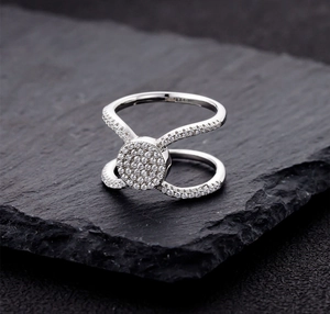 Macro shot of S925 sterling silver ring with double-layered band and pavé set round disc