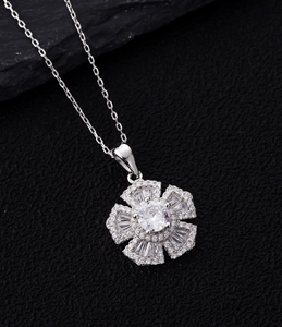 Macro view of S925 silver flower necklace with sparkling pave diamonds and center stone