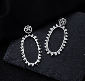 Detail of S925 silver long oval hollow earrings with micro-pave cubic zirconia settings