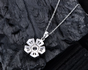 Detailed back view of S925 sterling silver flower pendant showing fine hollow craftsmanship