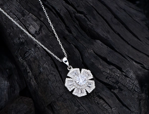 Detailed view of silver flower pendant necklace with high-carbon diamond floral cluster