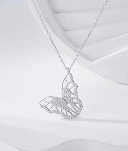 Detailed macro view of S925 sterling silver butterfly pendant with micro-set zircon stones
