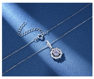 Close-up of 925 sterling silver necklace with lavender zirconia halo pendant details