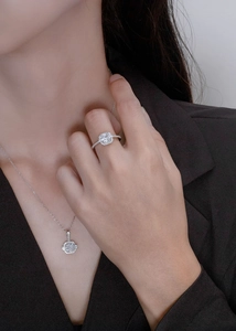 Detailed view of square-cut halo jewelry set featuring shimmering silver ring and necklace