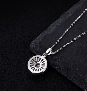 Macro detail of S925 sterling silver necklace pendant with radial cutout back design