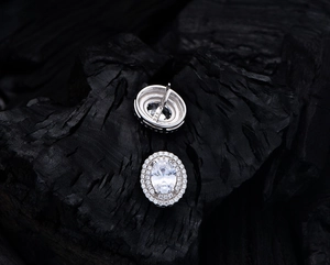 Macro shot showing 925 silver hallmark and oval high-carbon diamond stud earrings