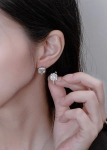 Macro shot of 925 silver square halo stud earrings with brilliant cubic zirconia stones
