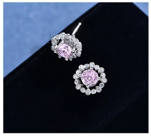 Macro shot of pink sunflower gemstone stud earrings in 925 sterling silver settings