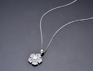 Close-up of S925 silver flower pendant necklace with shimmering cubic zirconia stones