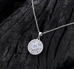 Macro detail of sunburst S925 sterling silver necklace with baguette and round diamonds