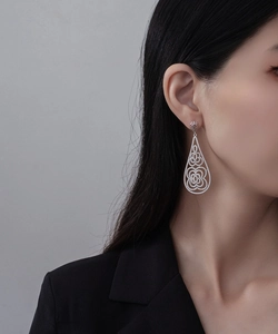 Close-up of luxury S925 silver chandelier earrings with micro-set floral waterdrop patterns