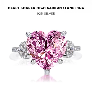 Macro detail of heart-shaped pink carbon diamond ring set in polished 925 silver