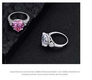 Close-up of pink and white heart-shaped high-carbon diamonds on S925 silver bands