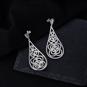 Luxury S925 sterling silver long drop earrings with intricate hollow floral patterns