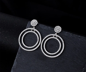 Close-up of double nested silver circle earrings with micro-paved sparkling diamonds