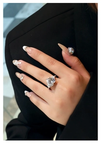 Luxurious 12mm heart-cut pink carbon diamond ring on hand with 925 silver band