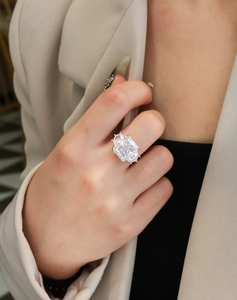 Close-up of 13ct radiant cut high carbon diamond ring with two-tone silver and gold claws