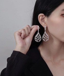 Detailed close-up of S925 sterling silver water drop earrings with zircon inlays