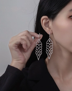 Close-up of geometric triangle tassel earrings with micro-inlaid zircon in S925 silver