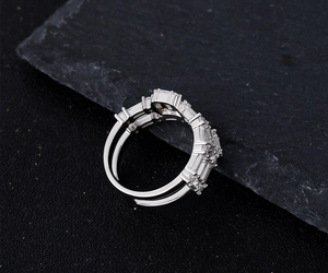 Macro detail of S925 silver ring featuring multi-layered baguette and round cubic zirconia