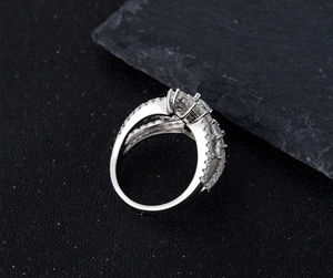 Macro shot of S925 sterling silver wheat-inspired ring with full cubic zirconia pavé