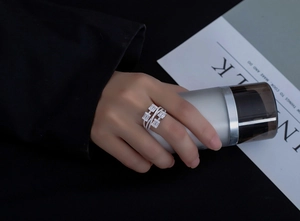 Detail of multi-layer S925 silver ring with rectangular zircon stones worn on hand
