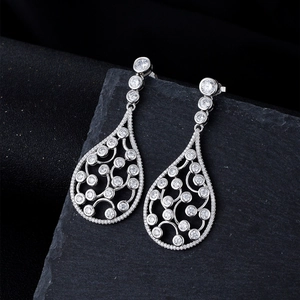 Exquisite S925 sterling silver waterdrop earrings with hollow swirls and crystals
