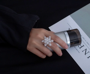 Exquisite snowflake ring featuring sparkling micro-pave crystals on silver metal band