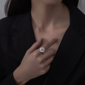 Elegant micro-paved flower zircon ring in S925 sterling silver worn by a model