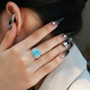 13ct light blue radiant cut gemstone ring in 925 silver with gold-tone accents