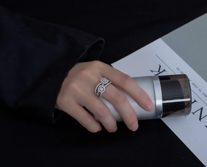 Detailed view of elegant S925 sterling silver ring with double halo pavé cubic zirconia