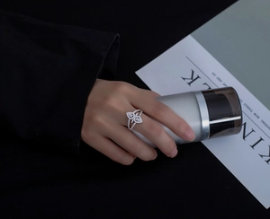Close-up of 925 silver micro-paved teardrop ring with intricate cutout patterns