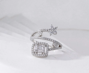 Macro view of S925 silver multi-layer star ring with cubic zirconia flower accents