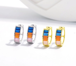 Detailed view of S925 silver and gold huggie hoop earrings with colorful zircon stones