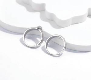 Macro shot of S925 sterling silver ring set with micro-paved diamonds and polished finish