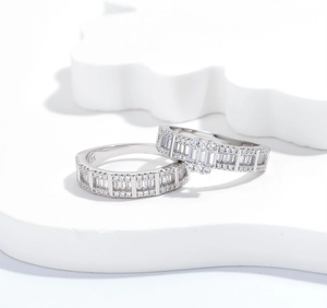 Close-up of S925 sterling silver rings featuring pavé set baguette and round zircon stones