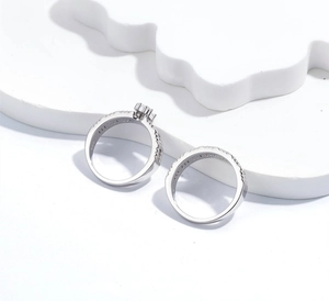 Close-up of S925 sterling silver ring set with six-prong pave cubic zirconia stones
