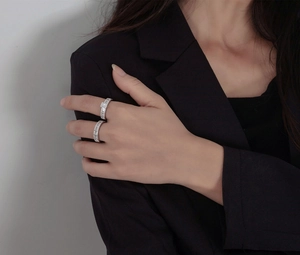 Detailed view of silver stackable rings set with baguette-cut pavé cubic zirconia