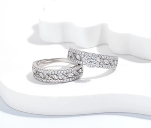 Macro shot of S925 silver rings with rhombic diamonds and elegant vine texture