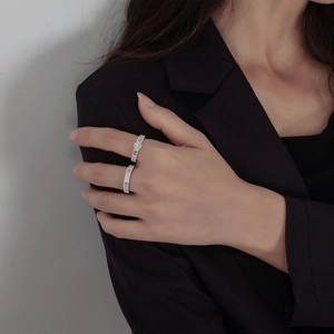 Luxurious S925 sterling silver stacked ring set featuring micro-pave crystals on black suit