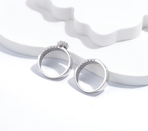 Macro shot of S925 sterling silver rings with snowflake clusters and pavé-set stones