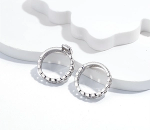 Macro detail of S925 sterling silver ring set with square diamond and wavy band